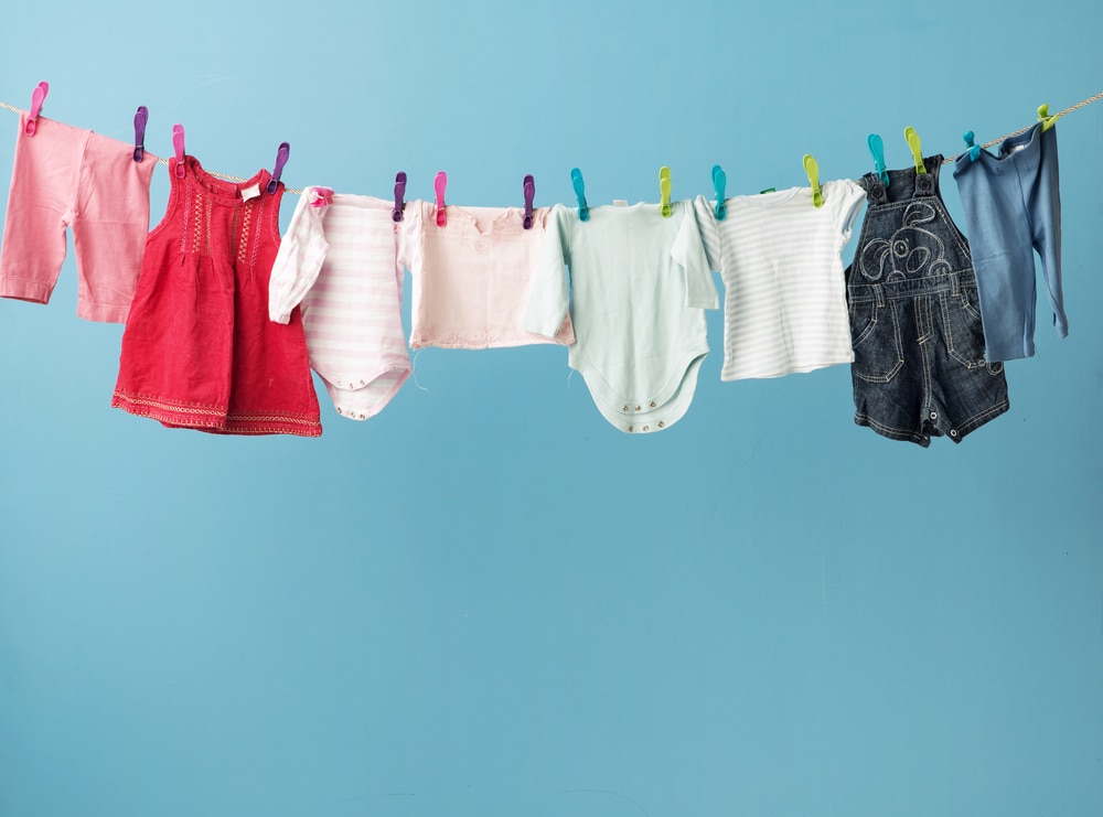Baby clothes hanging on the clothesline.
