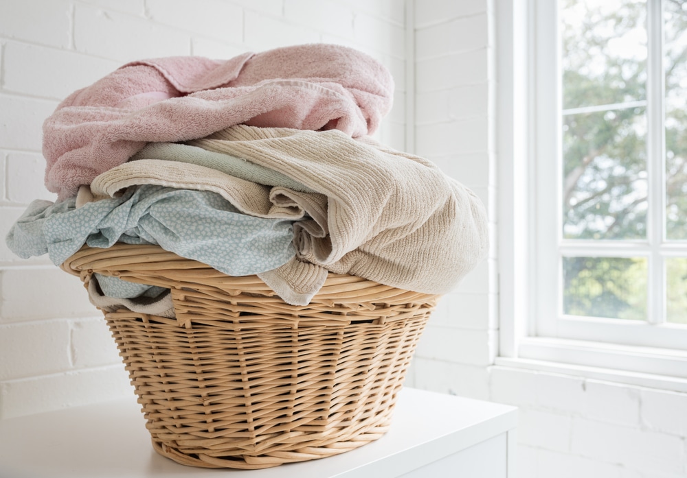 laundry basket with sheets ad towels