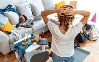 Woman preparing her living room before house cleaners arrive